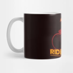 Silhouette of a cyclist man with a mountain hot colors evening landspace inside and a ride free, born to be cyclist legend. Biker and bicycle art t shirt and stamp concept Mug